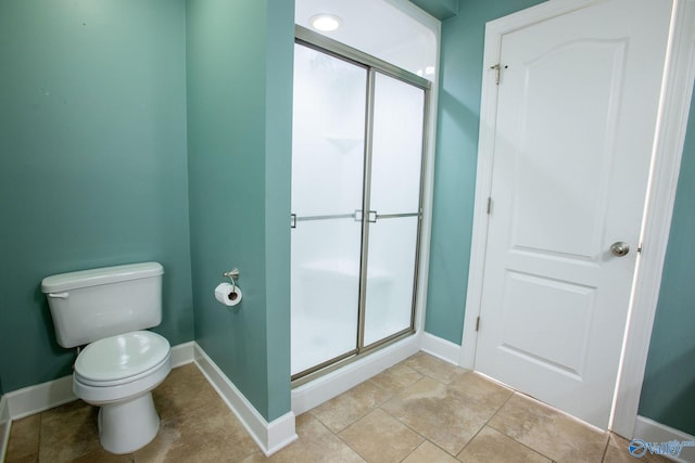 bathroom featuring toilet and walk in shower