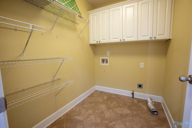 laundry area featuring washer hookup, cabinets, light tile patterned floors, and hookup for an electric dryer