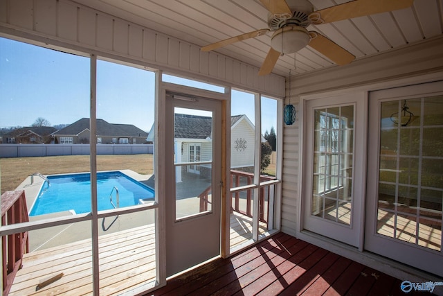 sunroom / solarium with ceiling fan and a wealth of natural light