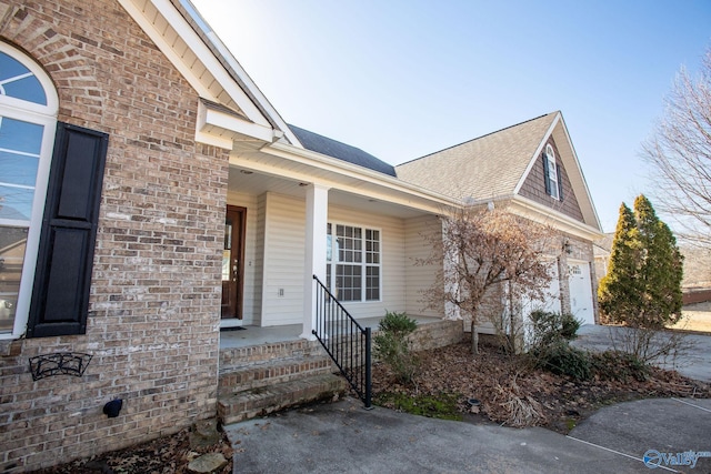 view of front of home with a garage and covered porch