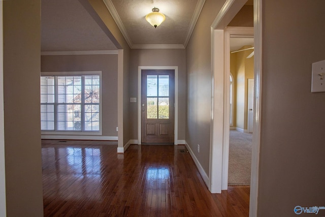 foyer featuring ornamental molding and dark wood-type flooring