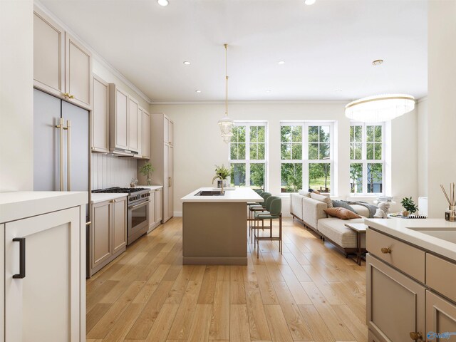 6103C Randolph Ave Unit 3C, Huntsville, AL 35801 - kitchen with high end stainless steel range, a sink, light wood finished floors, light countertops, and recessed lighting