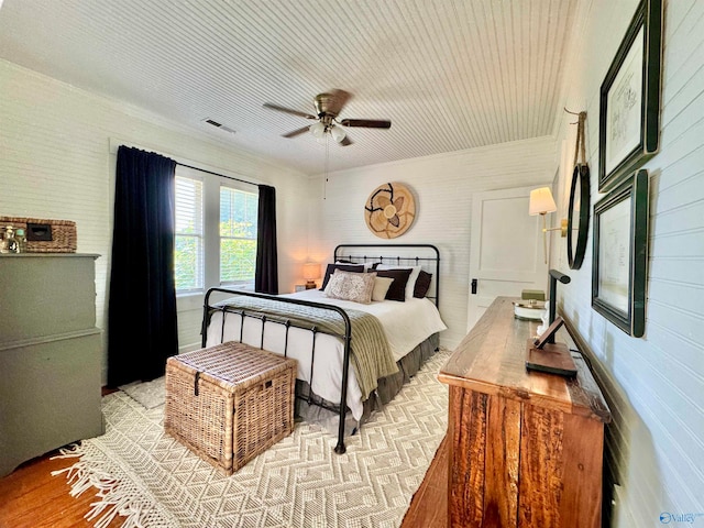 bedroom featuring ceiling fan and light hardwood / wood-style floors