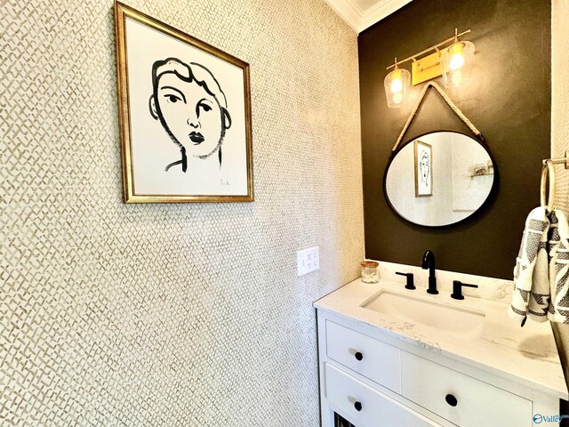 bathroom featuring vanity and ornamental molding