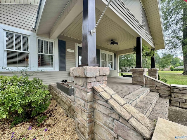 view of patio featuring ceiling fan and a porch