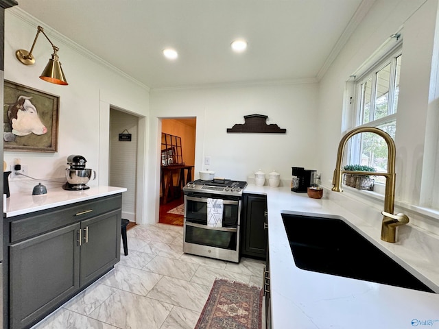 kitchen with light tile patterned floors, sink, range with two ovens, and ornamental molding