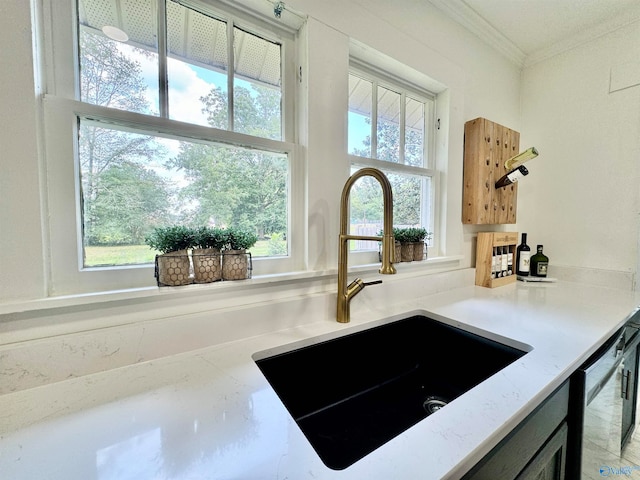 room details featuring sink, light stone counters, and dishwasher