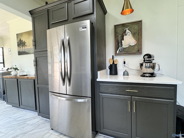 kitchen featuring freestanding refrigerator