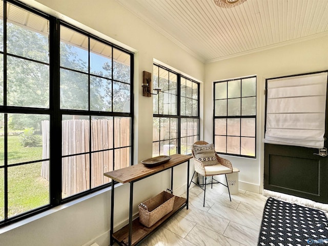 sunroom / solarium featuring wooden ceiling and plenty of natural light