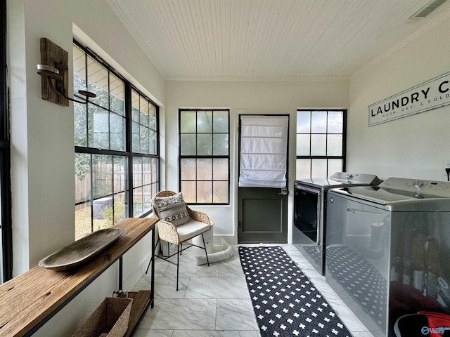 laundry room with marble finish floor, visible vents, ornamental molding, separate washer and dryer, and laundry area