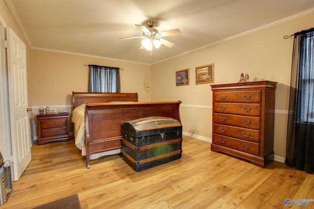 bedroom featuring light wood-style flooring, ornamental molding, ceiling fan, and baseboards