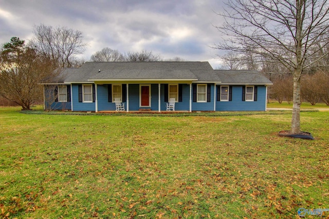 ranch-style house with a porch and a front yard