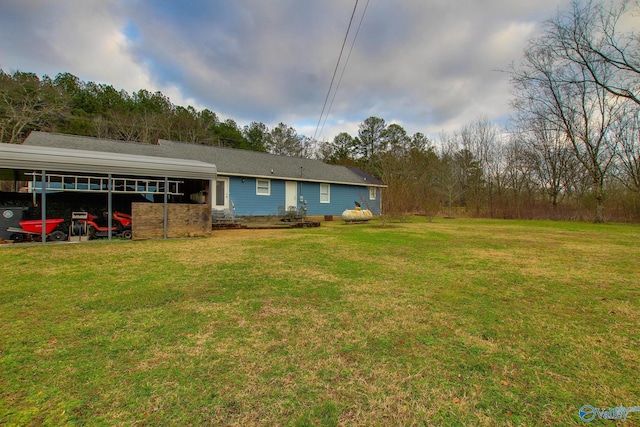 exterior space with a carport and a lawn