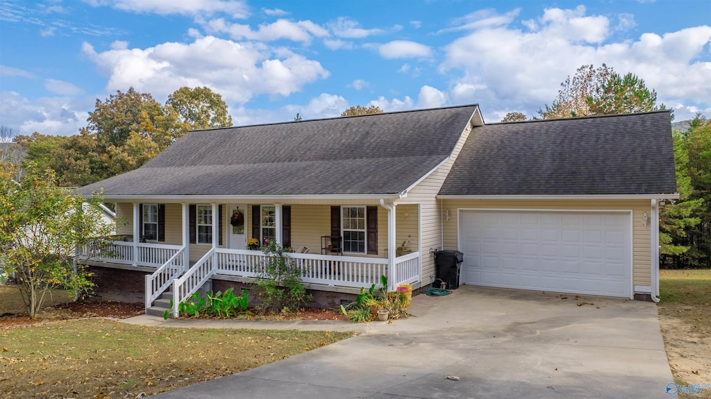 view of front of home featuring a garage and covered porch