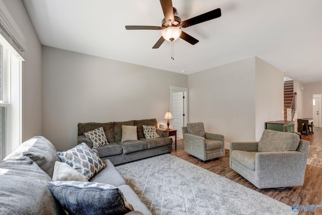 living room with ceiling fan and hardwood / wood-style flooring