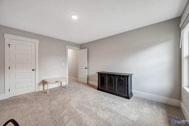 unfurnished bedroom with light carpet