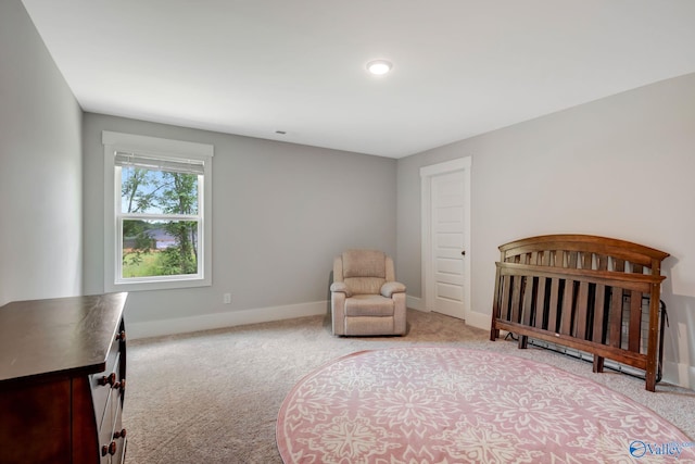 bedroom featuring light colored carpet