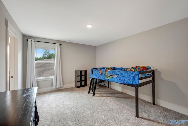 bedroom featuring light carpet