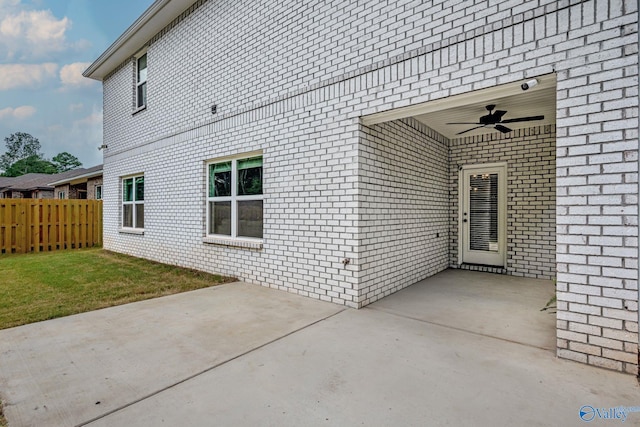 exterior space featuring ceiling fan and a patio