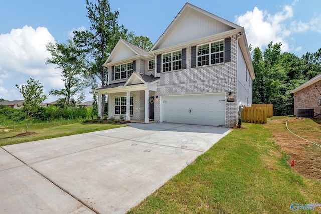 view of front facade featuring central AC, a garage, and a front yard