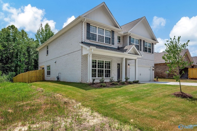 view of front of house with a garage and a front yard