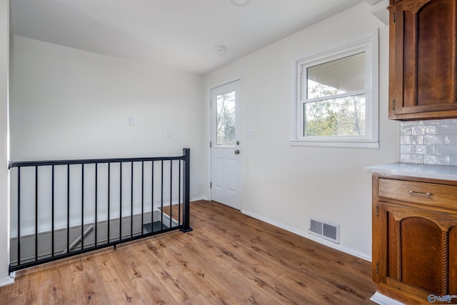 1002 Woodbine Rd, Madison, AL 35758 - foyer featuring light wood-style floors, visible vents, and baseboards