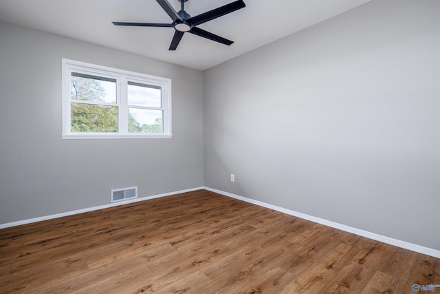 1002 Woodbine Rd, Madison, AL 35758 - unfurnished room with wood finished floors, visible vents, a ceiling fan, and baseboards