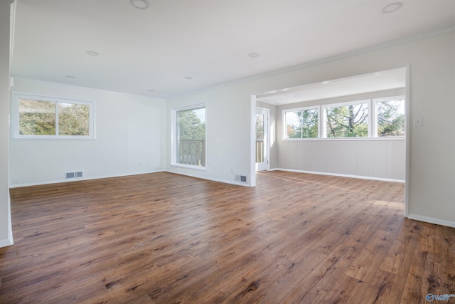 1002 Woodbine Rd, Madison, AL 35758 - empty room with visible vents, crown molding, and a healthy amount of sunlight