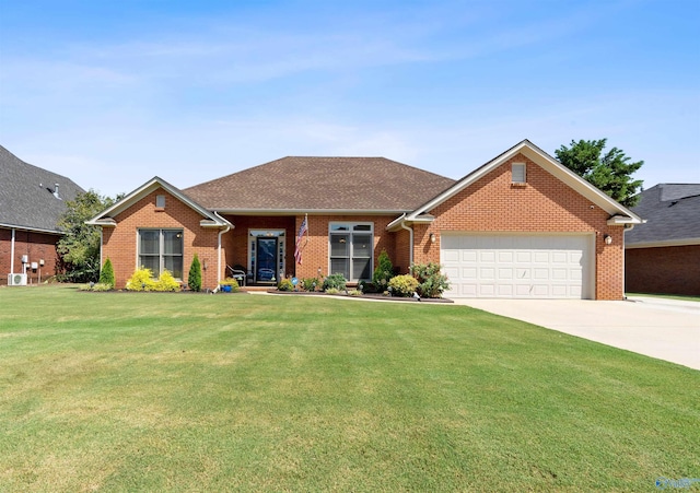 single story home featuring a front yard, driveway, brick siding, and a garage