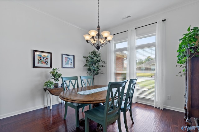 dining space with visible vents, baseboards, dark wood-style flooring, ornamental molding, and a chandelier
