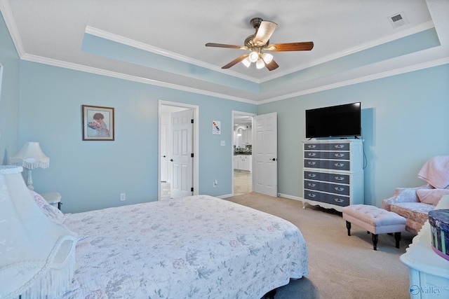 bedroom with visible vents, ornamental molding, a ceiling fan, a tray ceiling, and light colored carpet