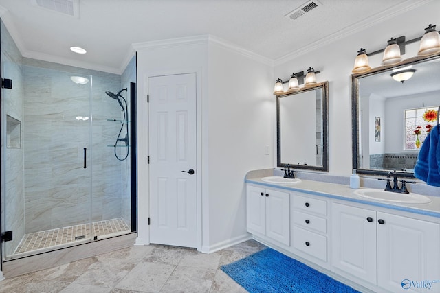 full bathroom featuring a shower stall, visible vents, and a sink