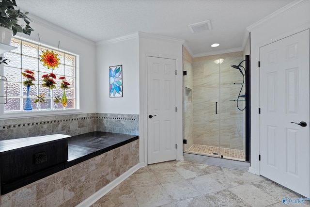 bathroom featuring a shower stall, visible vents, and crown molding