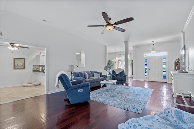 living area featuring ceiling fan, baseboards, visible vents, and hardwood / wood-style flooring