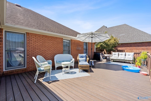 deck featuring outdoor lounge area