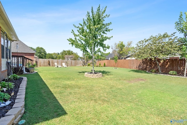 view of yard with a fenced backyard