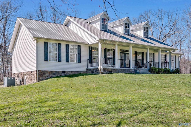 cape cod home featuring a porch, a front lawn, and metal roof