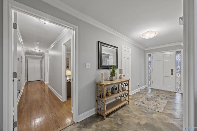 foyer entrance featuring crown molding and wood-type flooring