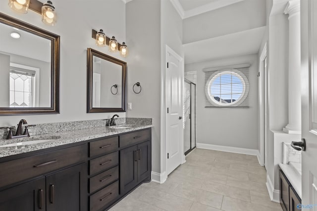 bathroom with vanity, tile patterned floors, an enclosed shower, and crown molding