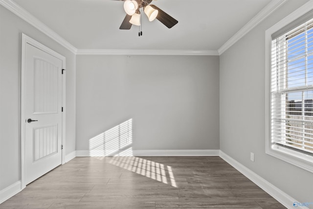 spare room featuring crown molding, hardwood / wood-style floors, and ceiling fan