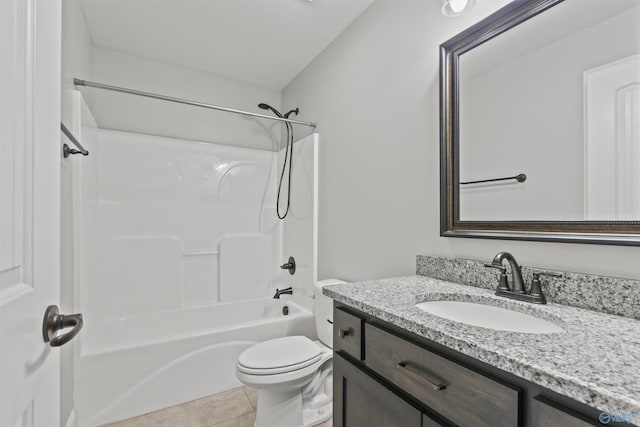 full bathroom featuring tile patterned floors, toilet, vanity, and bathing tub / shower combination