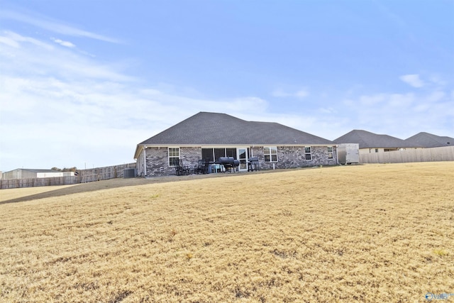 rear view of property with central AC unit