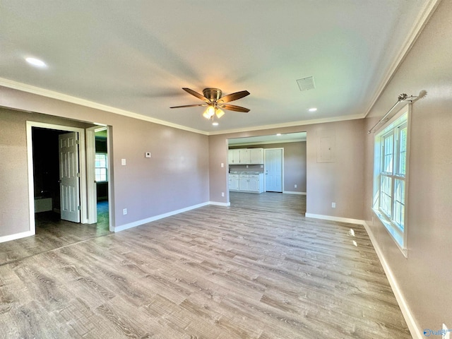 unfurnished bedroom featuring ceiling fan, light hardwood / wood-style floors, and ornamental molding