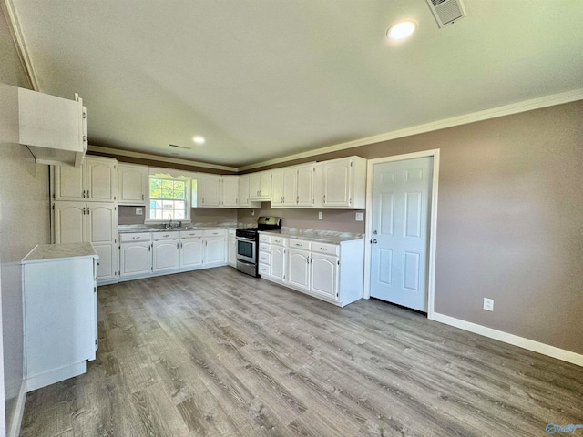 kitchen featuring white cabinetry, crown molding, light hardwood / wood-style floors, stainless steel range oven, and sink