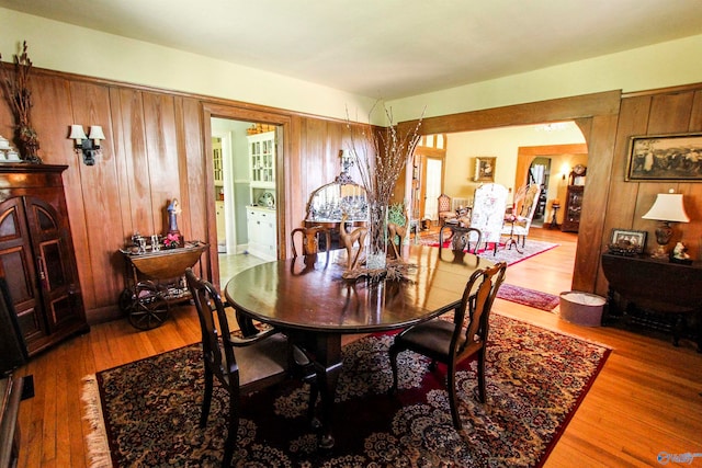 dining space with hardwood / wood-style floors