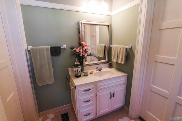 bathroom with tile patterned floors and vanity