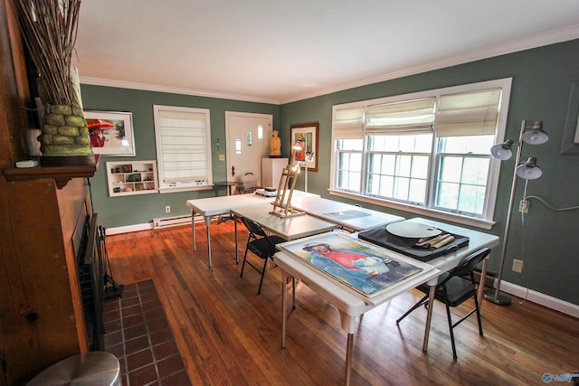 dining area with crown molding, baseboard heating, and dark hardwood / wood-style flooring