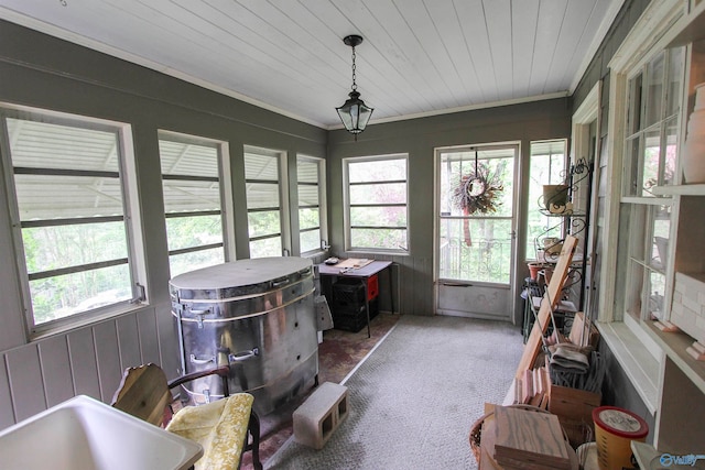 sunroom / solarium featuring a wealth of natural light and sink