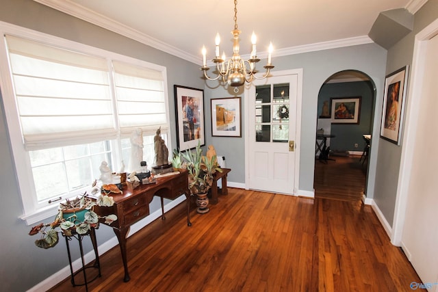 interior space with a notable chandelier, wood-type flooring, and ornamental molding