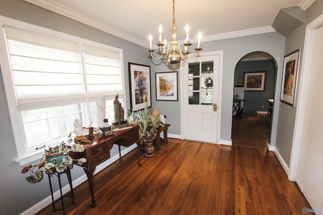 foyer featuring arched walkways, a healthy amount of sunlight, ornamental molding, and dark wood-style flooring